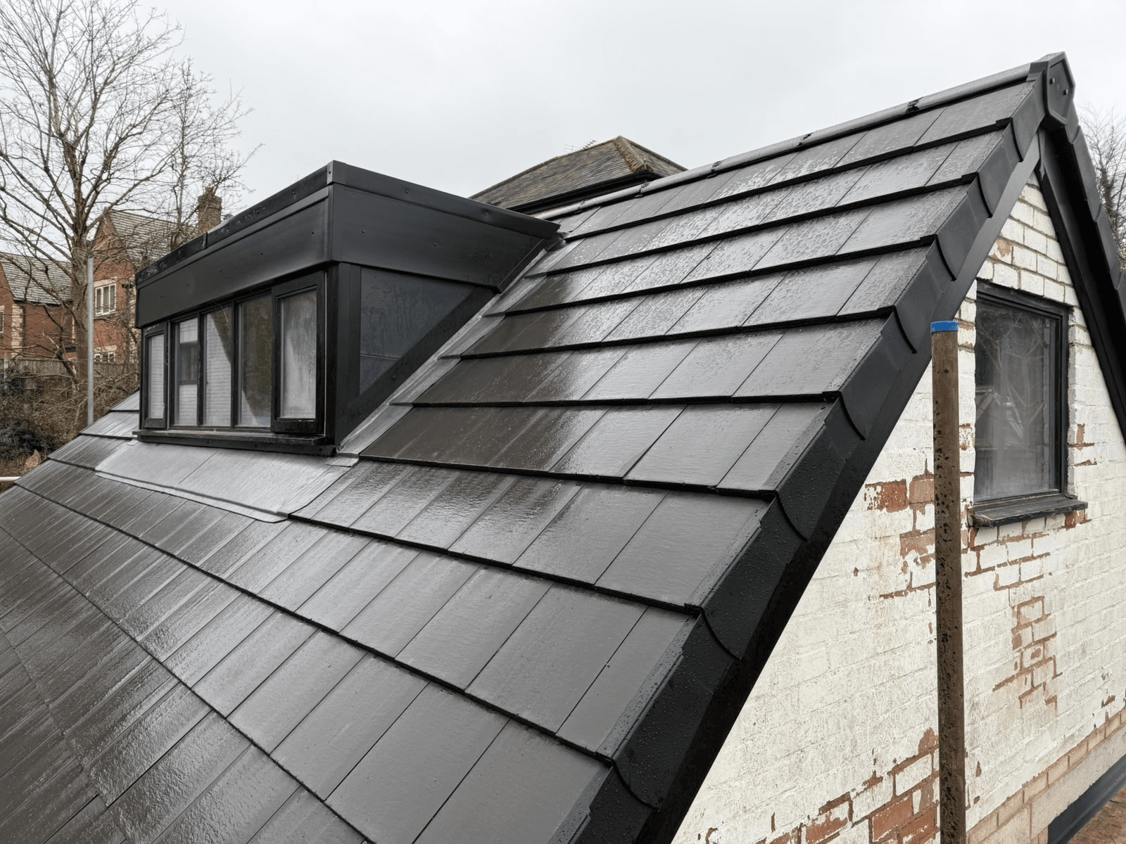 Heritage Roofline Services — completed slate roof with dormer