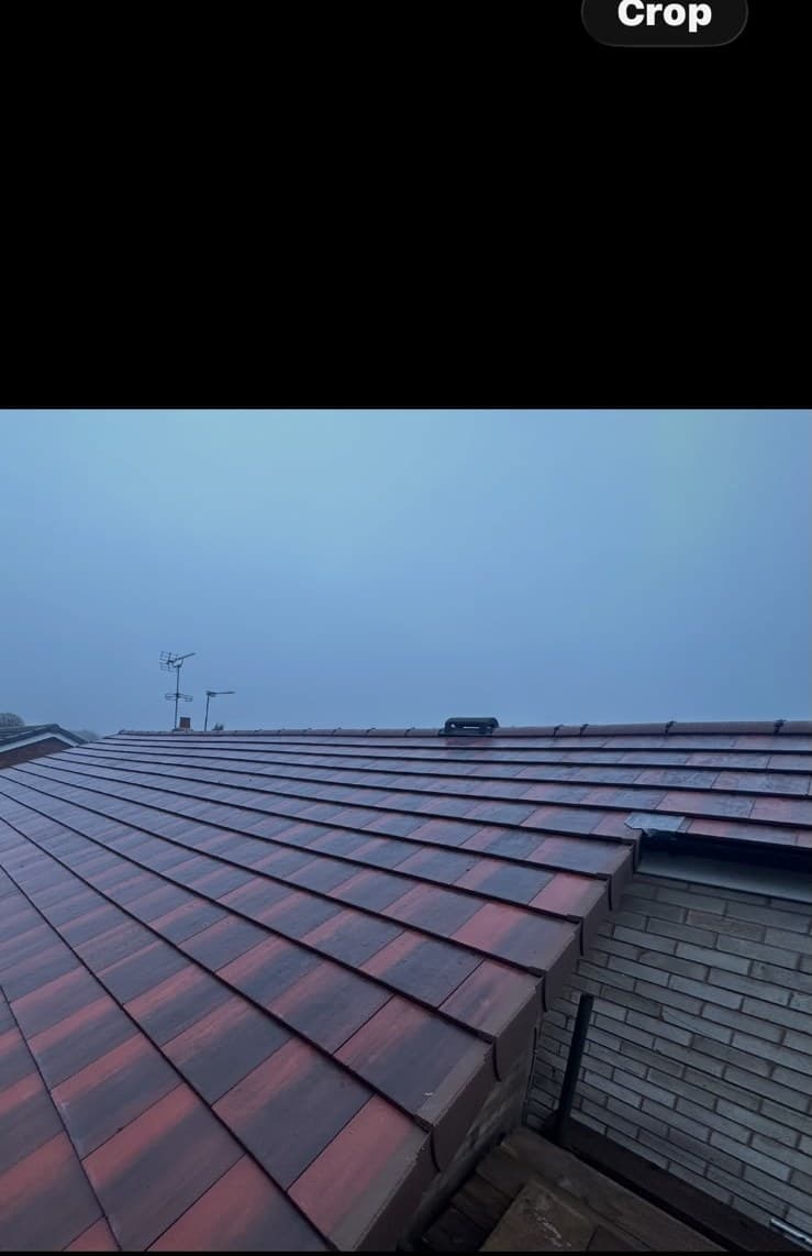 Evening shot of completed tiled roof with dormer detail
